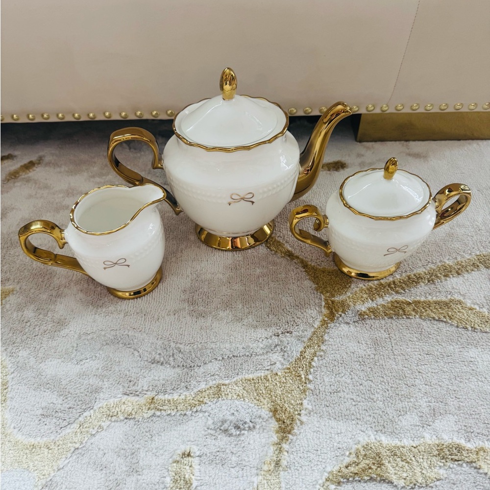 Elegant White and Gold Bow Tea Set